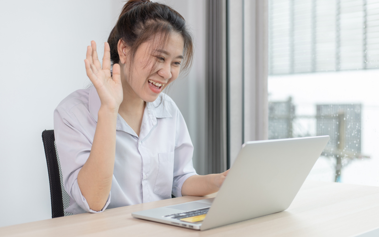 Woman Doing Virtual Communication Through Laptop 